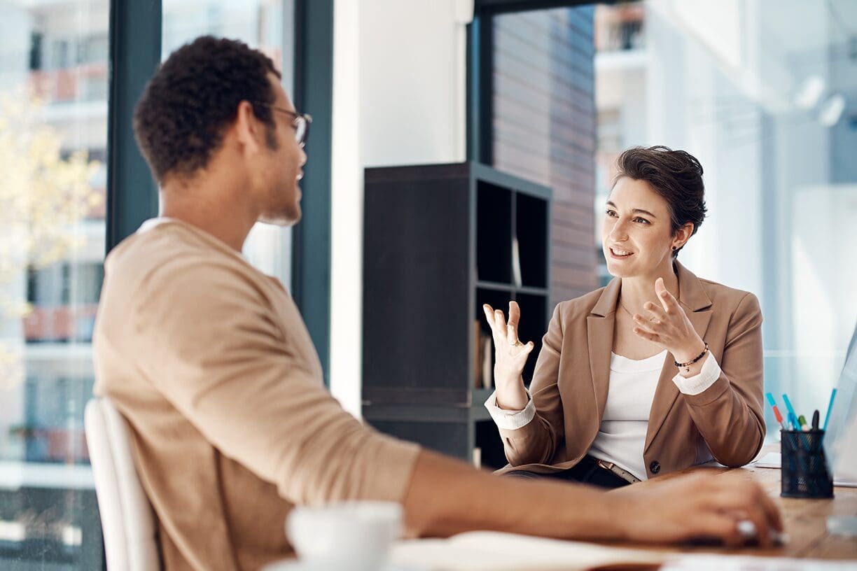 Engaging conversation in a modern office setting.